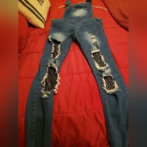Really cute distressed overall jeans with black mesh under holes. Size 1/2.